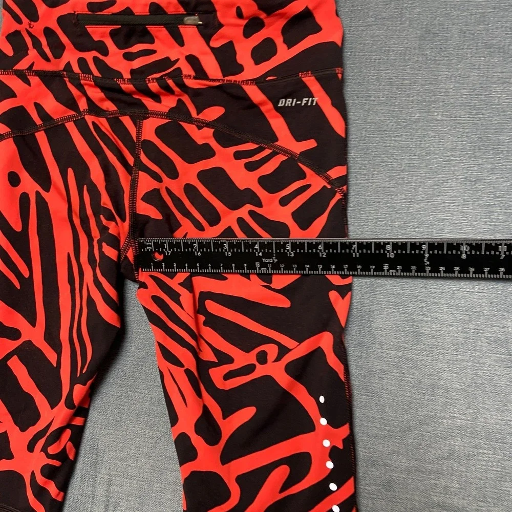 Nike Dri Fit Power Epic Lux Capri Leggings Womens XS Black Orange Abstract Print